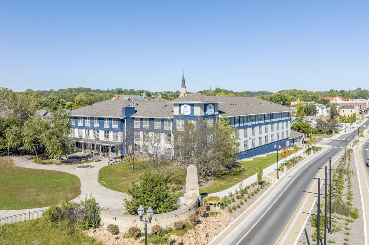 Aerial exterior view of TownSquare Place along the Minnesota River in downtown Chaska